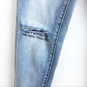 BIANCO 25 light wash distressed graphic jeans